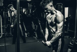 grayscale photo of man exercising